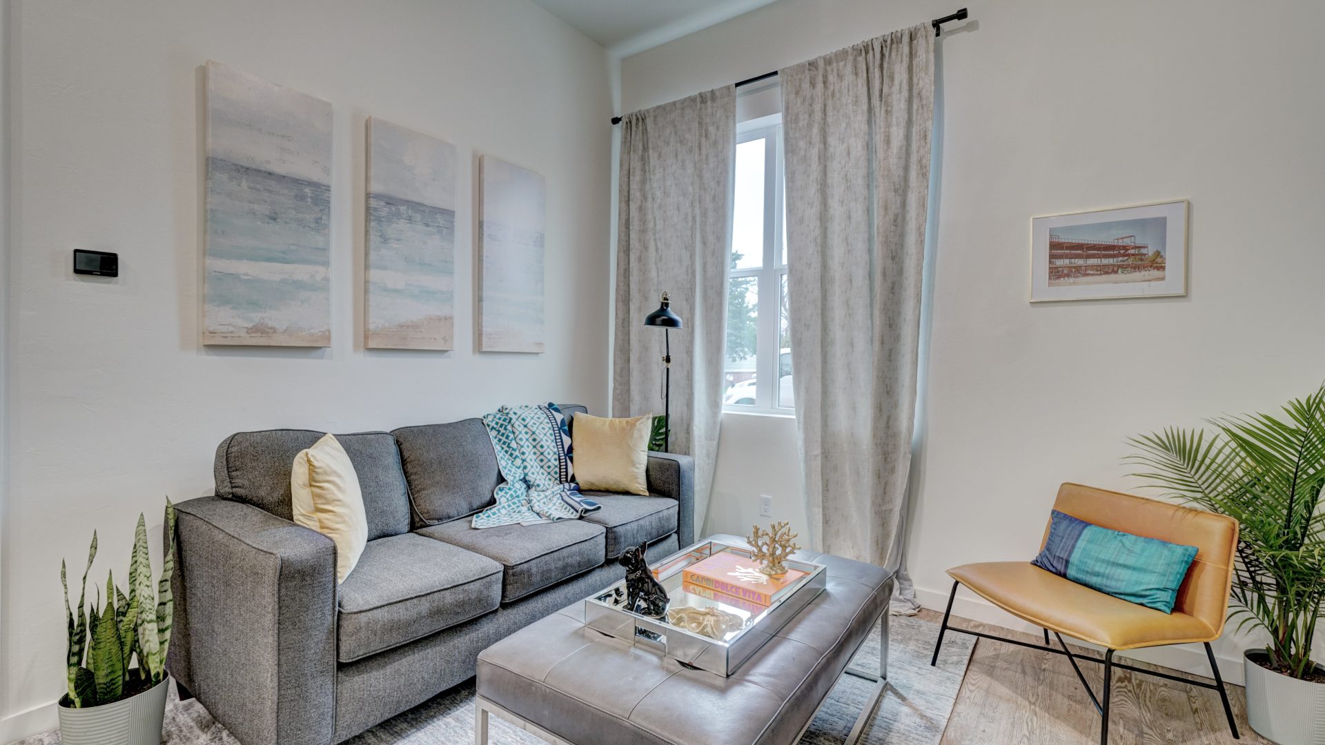 a living room with a couch, coffee table and two chairs at The  Campbell