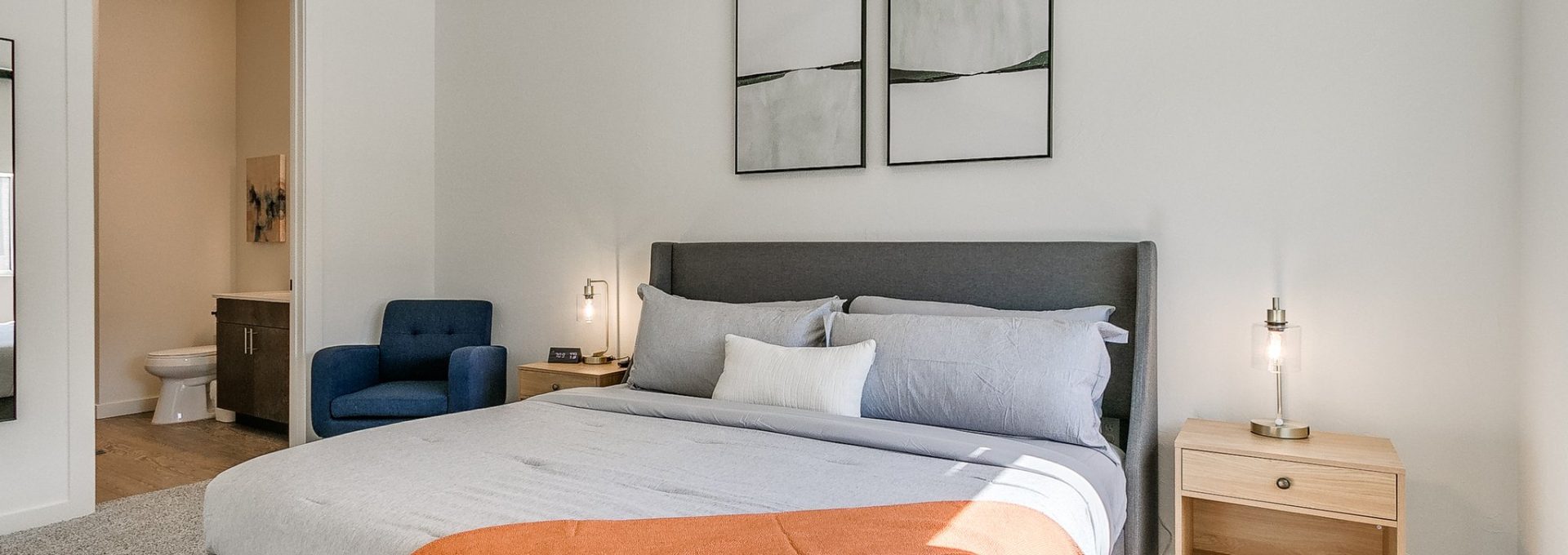 a bedroom with a bed, a chair and a television at The  Campbell